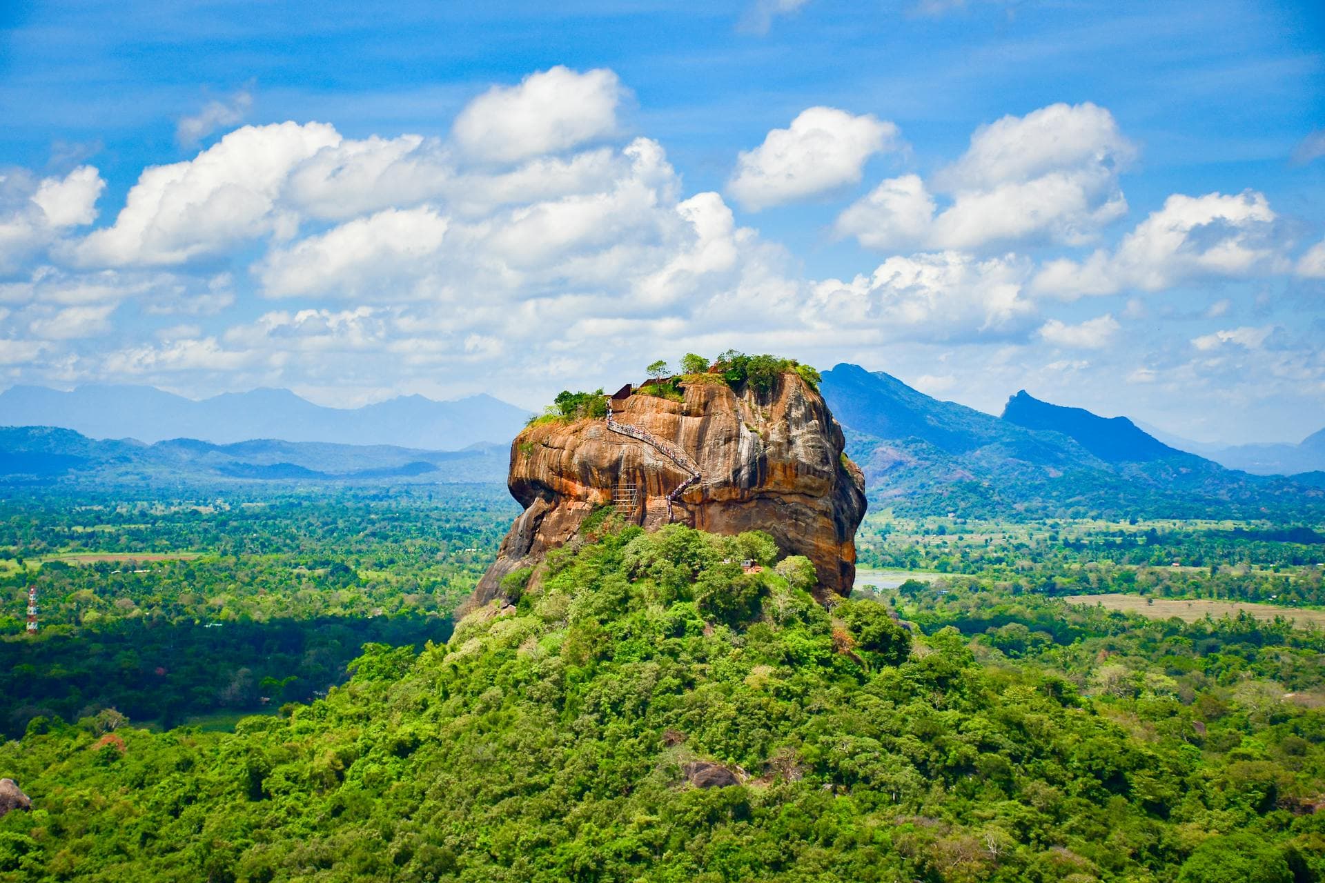 Sigiriya Rock Fortress rising above the lush Sri Lankan jungle